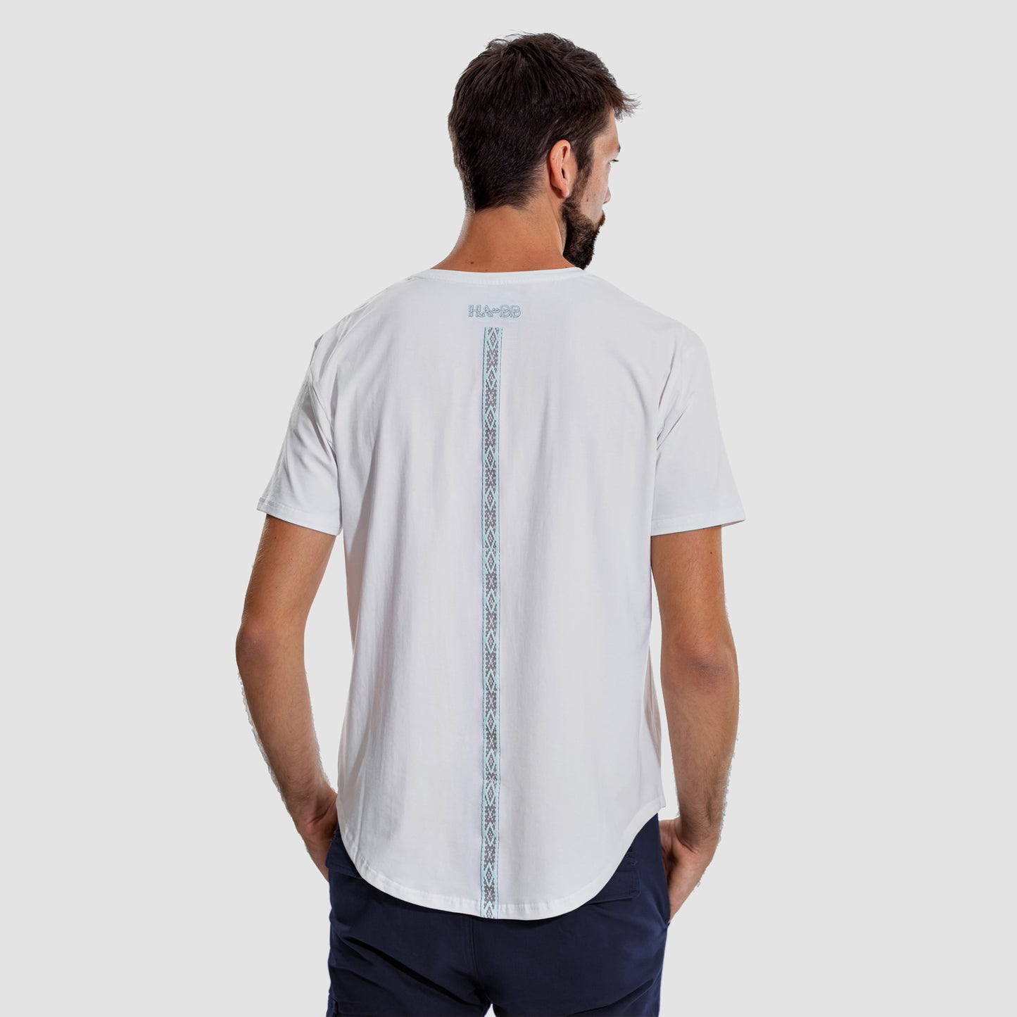 White T-shirt, front pocket, short sleeves, Al Sadu, Print, rounded bottom, modern, Man, back view, model
